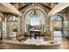 Elegant living room with stone walls and mountain views at 11068 E Canyon Cross Way, Scottsdale, AZ 85255