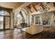 Spacious living room with stone walls and mountain views at 11068 E Canyon Cross Way, Scottsdale, AZ 85255