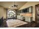 Home office with built-in shelves and a large window at 11068 E Canyon Cross Way, Scottsdale, AZ 85255