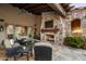 Cozy outdoor fireplace and seating area at 11068 E Canyon Cross Way, Scottsdale, AZ 85255