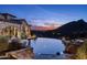 Expansive infinity pool and patio area with scenic background at 11068 E Canyon Cross Way, Scottsdale, AZ 85255