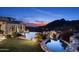 Luxury pool and patio with mountain views at sunset at 11068 E Canyon Cross Way, Scottsdale, AZ 85255