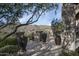 Spacious stone patio with mountain views and planters at 11068 E Canyon Cross Way, Scottsdale, AZ 85255