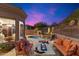 Relaxing backyard with pool, fire pit, and seating area at 11132 E Juan Tabo Rd, Scottsdale, AZ 85255