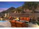 Peaceful backyard oasis with a fire pit and mountain views at 11132 E Juan Tabo Rd, Scottsdale, AZ 85255