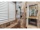 Spa-like bathroom with walk-in shower, soaking tub, and dual vanities at 11132 E Juan Tabo Rd, Scottsdale, AZ 85255
