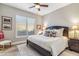 Bright bedroom with a king-size bed and window seating at 11132 E Juan Tabo Rd, Scottsdale, AZ 85255