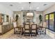Elegant dining room with wine storage and access to patio at 11132 E Juan Tabo Rd, Scottsdale, AZ 85255