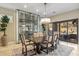 Formal dining room with wine storage and patio access at 11132 E Juan Tabo Rd, Scottsdale, AZ 85255