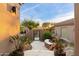 Inviting entryway with courtyard and wrought-iron gate at 11132 E Juan Tabo Rd, Scottsdale, AZ 85255