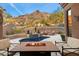 Cozy fire pit with seating area and mountain views at 11132 E Juan Tabo Rd, Scottsdale, AZ 85255