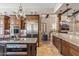Island kitchen with stainless steel appliances and granite countertops at 11132 E Juan Tabo Rd, Scottsdale, AZ 85255