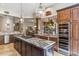 Gourmet kitchen with granite island and wine cooler at 11132 E Juan Tabo Rd, Scottsdale, AZ 85255