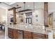 Island kitchen with granite countertops and wood cabinets at 11132 E Juan Tabo Rd, Scottsdale, AZ 85255