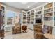 Spacious library with built-in shelving, comfortable seating, and natural light at 11132 E Juan Tabo Rd, Scottsdale, AZ 85255