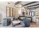 Elegant living room with seating area and large chandelier at 11132 E Juan Tabo Rd, Scottsdale, AZ 85255
