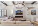 Spacious living room with fireplace and large TV at 11132 E Juan Tabo Rd, Scottsdale, AZ 85255