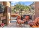 Well-equipped outdoor kitchen with seating area and mountain views at 11132 E Juan Tabo Rd, Scottsdale, AZ 85255