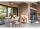 Covered patio with dining table and seating at 11132 E Juan Tabo Rd, Scottsdale, AZ 85255