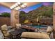 Covered patio with fire pit, mountain views, and pool access at 11132 E Juan Tabo Rd, Scottsdale, AZ 85255