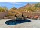 Tranquil pool area with water feature and mountain backdrop at 11132 E Juan Tabo Rd, Scottsdale, AZ 85255