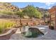 Relaxing pool area with a water feature and mountain backdrop at 11132 E Juan Tabo Rd, Scottsdale, AZ 85255