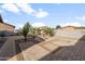 Backyard with firepit and geometric brick paver patio at 1416 W Birch Rd, San Tan Valley, AZ 85140