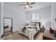 Bright bedroom with wood-look floors and ceiling fan at 20865 E Timberline Rd, Queen Creek, AZ 85142