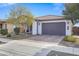 House exterior with two-car garage and landscaping at 20865 E Timberline Rd, Queen Creek, AZ 85142