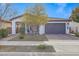 One-story home with a two-car garage and a landscaped front yard at 20865 E Timberline Rd, Queen Creek, AZ 85142