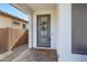 Modern front door with glass panels and a stylish wreath at 20865 E Timberline Rd, Queen Creek, AZ 85142