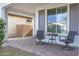 Small front porch with patio furniture at 20865 E Timberline Rd, Queen Creek, AZ 85142