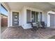 Front porch with a small table and chairs, great for relaxing at 20865 E Timberline Rd, Queen Creek, AZ 85142