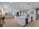 Open kitchen with white cabinets, an island, and stainless steel appliances at 20865 E Timberline Rd, Queen Creek, AZ 85142