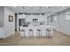 Modern kitchen with white cabinets, a large island, and pendant lighting at 20865 E Timberline Rd, Queen Creek, AZ 85142