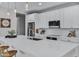 Modern kitchen with white cabinets, quartz countertops, and stainless steel appliances at 20865 E Timberline Rd, Queen Creek, AZ 85142