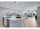 Open floor plan kitchen and living area with white kitchen island at 20865 E Timberline Rd, Queen Creek, AZ 85142