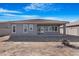 House exterior showcasing backyard and patio at 21576 E Pecan Ct, Queen Creek, AZ 85142