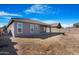House exterior showcasing backyard and patio at 21576 E Pecan Ct, Queen Creek, AZ 85142