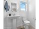 Clean bathroom with pedestal sink and toilet at 21576 E Pecan Ct, Queen Creek, AZ 85142