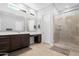 Large bathroom with double vanity and walk-in shower at 21576 E Pecan Ct, Queen Creek, AZ 85142
