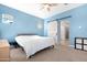 Spacious bedroom with barn door and ensuite bathroom at 21576 E Pecan Ct, Queen Creek, AZ 85142
