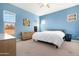 Spacious bedroom with light blue walls and a comfortable bed at 21576 E Pecan Ct, Queen Creek, AZ 85142