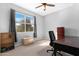 Bedroom with large window, desk and bookshelf at 21576 E Pecan Ct, Queen Creek, AZ 85142