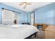 Bright bedroom with wood desk and plenty of natural light at 21576 E Pecan Ct, Queen Creek, AZ 85142
