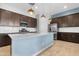 Modern kitchen featuring stainless steel appliances and a large island at 21576 E Pecan Ct, Queen Creek, AZ 85142
