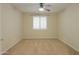 Simple bedroom with carpeted floors and ceiling fan at 3214 N Desert Horizons Ln, Casa Grande, AZ 85122