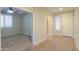 Hallway view of a bedroom and entryway with tile flooring at 3214 N Desert Horizons Ln, Casa Grande, AZ 85122