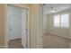 Hallway with doors to a bedroom and bathroom, featuring tile floors at 3214 N Desert Horizons Ln, Casa Grande, AZ 85122