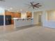 Open kitchen features wood cabinets and granite countertops at 3214 N Desert Horizons Ln, Casa Grande, AZ 85122